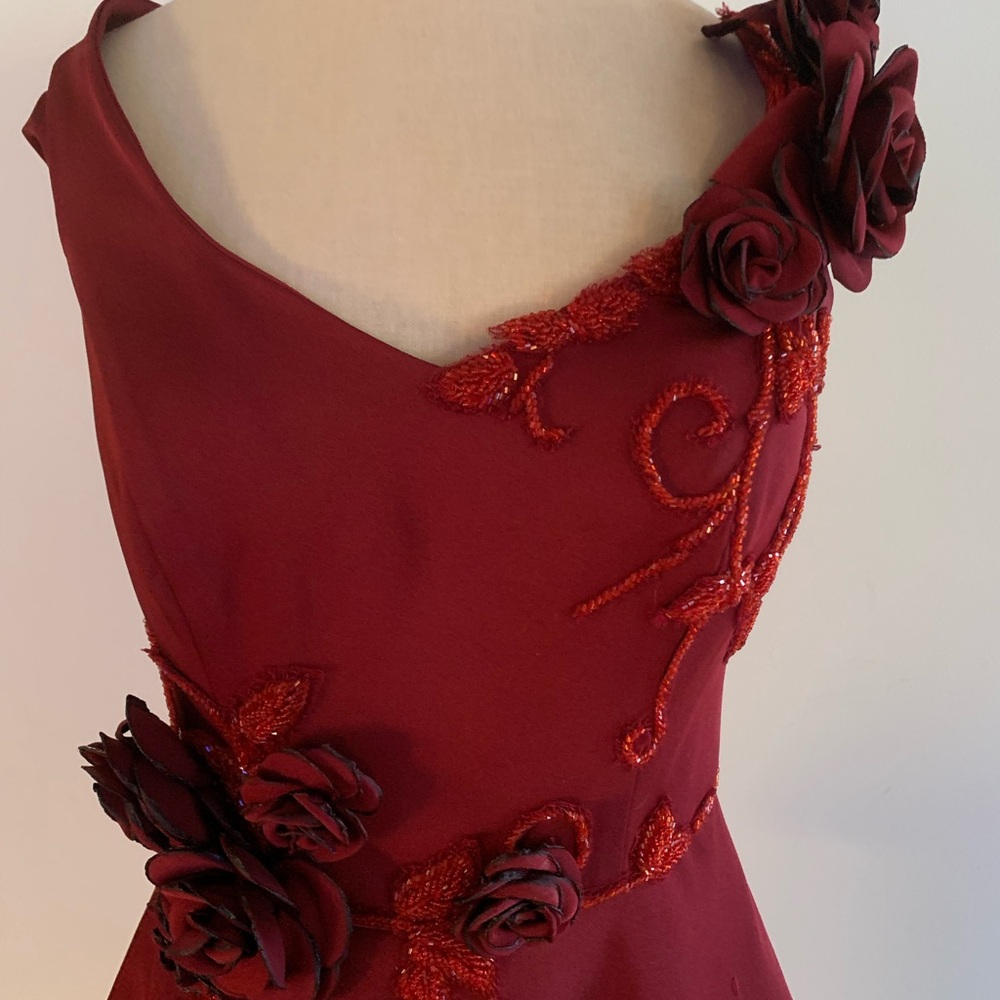 Tariq Ediz burgundy off the shoulder peplum evening gown.
